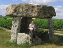 Tessa under some stones in a vineyard near Cognac